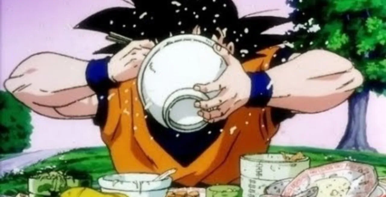 Personagem Goku comendo grande quantidade de comida