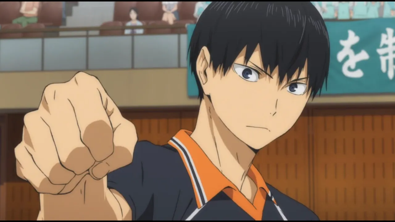 kageyama-estendendo-seu-punho-enquanto-usa-seu-uniforme-de-volei