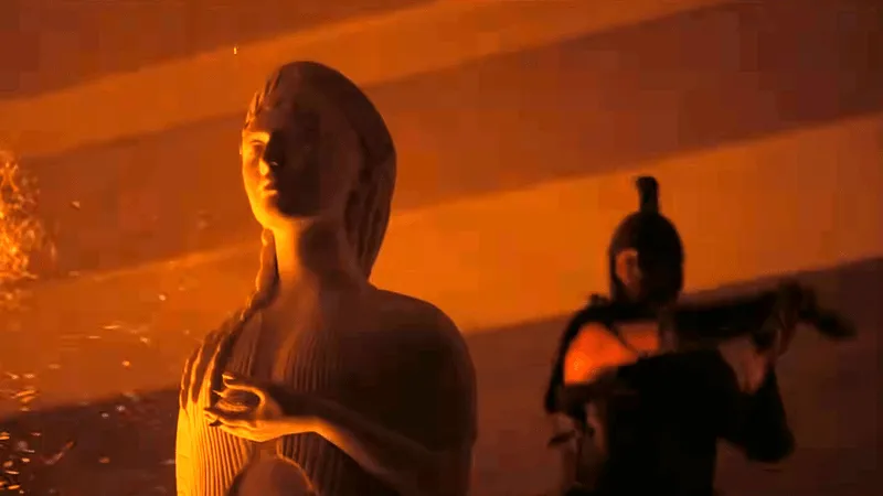 Cena em que Odisseu (Matt Damon) corta a cabeça da estátua de Atenas