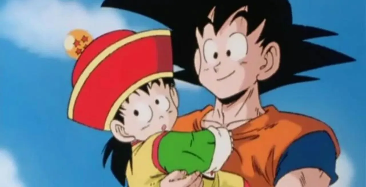 Personagens Gohan e Goku. Gohan está no colo de Goku