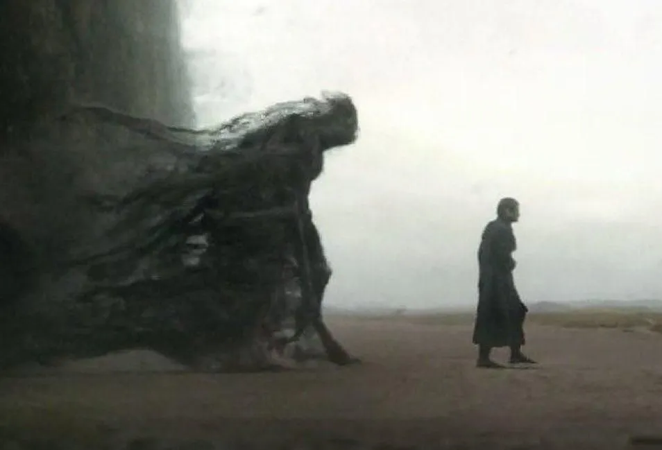 Monstro de sombra acompanhando homem em deserto
