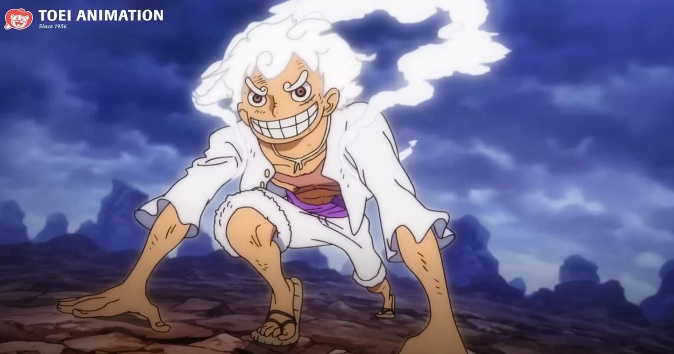 luffy na gear 5, em posição de preparação para uma corrida. ele está agachado, com as mãos no chão, como se fosse um corredor