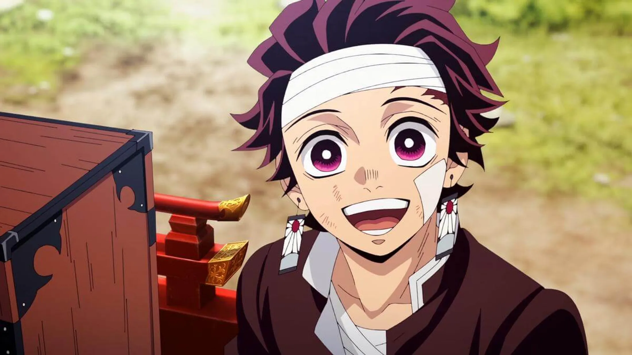 Personagem de Demon Slayer olhando sorridente para alguém.