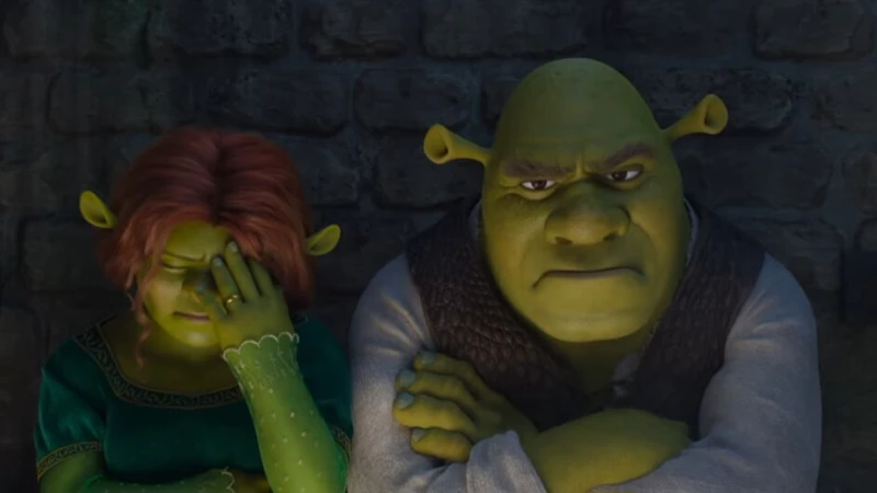 Shrek e Fiona sentados em uma cadeia chateados pela prisão