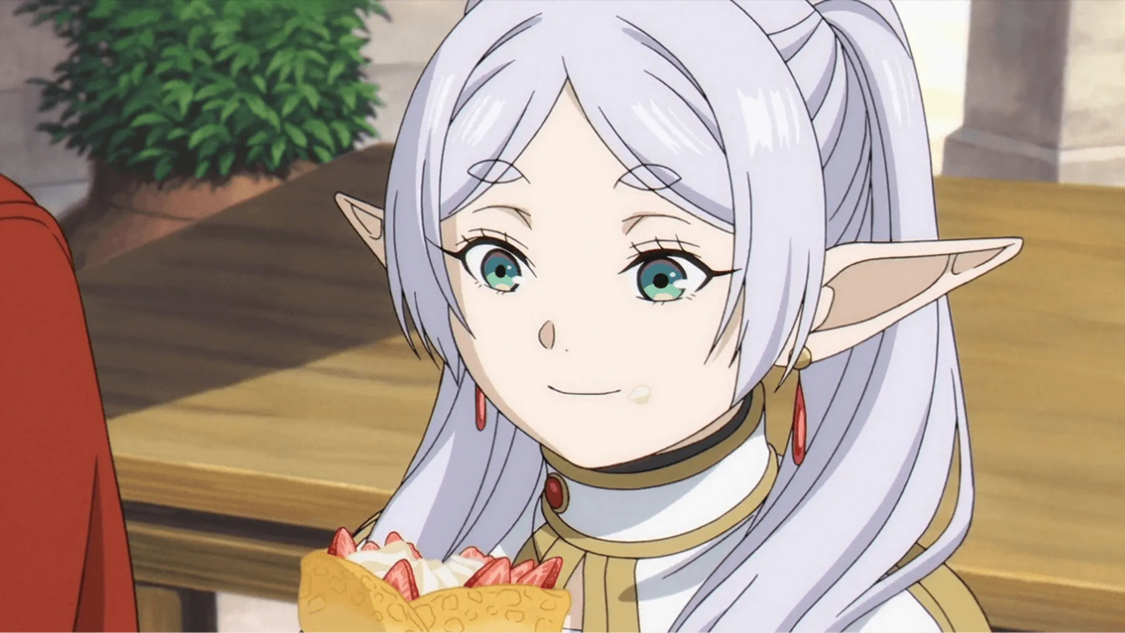 Frieren comendo crepe de morango